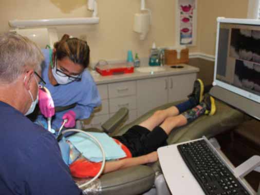 Pediatric dental patient in treatment room